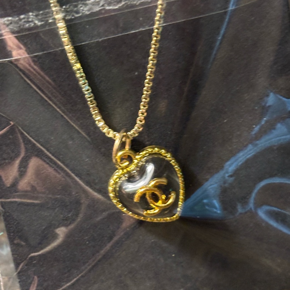 Upcycled zipper pull charm on unbranded chain